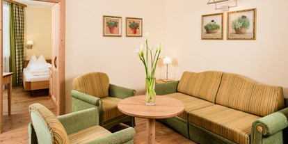 Hotels an der Piste - Preisniveau: gehoben - Wolkenstein in Gröden - "Pala di Santa" Suite Wohnbereich - Sporthotel Obereggen