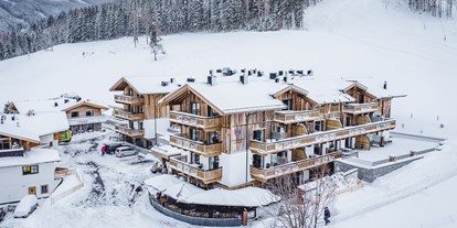 Hotels an der Piste - Ski-In Ski-Out - Skicircus Saalbach Hinterglemm Leogang Fieberbrunn - Aussenansicht Hotel | Exterior view hotel
 - Stockinggut by AvenidA | Hotel & Residences
