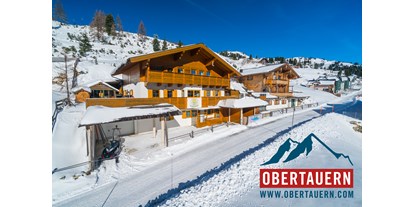 Hotels an der Piste - geführte Skitouren - Katschberghöhe - Ferienwohnungen Petergstamm in Obertauern, mitten im Winter, Pisten fußläufig in 1 Minute erreichbar. Genießen Sie den Traum der Tauernrunde. - Appartementhaus Petergstamm