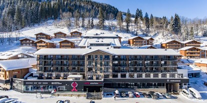 Hotels an der Piste - Skiraum: Skispinde - Snow Space Salzburg - Flachau - Wagrain - St. Johann - Außenansicht- Winter - Hotel Adapura Wagrain