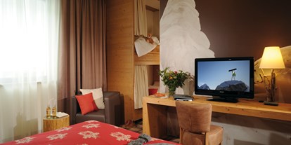 Hotels an der Piste - Suite mit offenem Kamin - Familienzimmer des Hotel Fire & Ice im Alpenpark Neuss - Hotel Fire & Ice Düsseldorf/Neuss