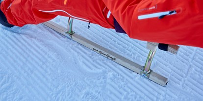 Hotels an der Piste - Skiservice: Skireparatur - Bayern - Rodeln mit dem Hotelschlitten - Kempinski Hotel Berchtesgaden