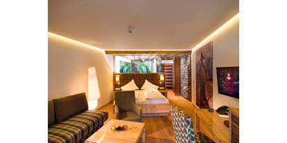 Hotels an der Piste - Suite mit offenem Kamin - Panoramasuite - Aktivhotel Alpendorf