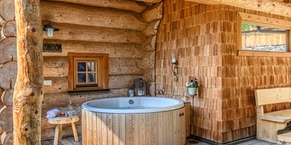 Hotels an der Piste - Ski-In Ski-Out - Dorfgastein - Aussen-Whirlwanne nutzbar das ganze Jahr - Premium Chalets Maria Alm