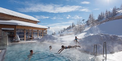 Hotels an der Piste - Wellnessbereich - Kanzelhöhe - Von der Piste direkt in die Pools - Mountain Resort Feuerberg