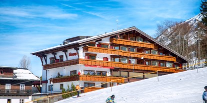 Hotels an der Piste - Trockenraum - Skigebiet Oberstdorf Kleinwalsertal - Ansicht Hotel Südseite zum Ideallift hin - Almhof Rupp - das Genießerhotel