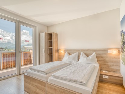 Hotels an der Piste - Ladestation Elektroauto - Reit im Winkl - Standard Zimmer - COOEE alpin Hotel Kitzbüheler Alpen