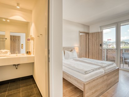 Hotels an der Piste - Preisniveau: moderat - Itter - Familienzimmer - COOEE alpin Hotel Kitzbüheler Alpen