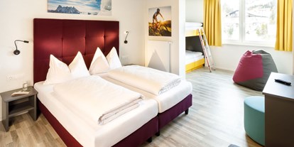 Hotels an der Piste - Sonnenterrasse - Altenmarkt (Lurnfeld) - Vierbettzimmer - Basekamp Mountain Budget Hotel