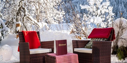Hotels an der Piste - WLAN - Kanzelhöhe - Blick auf unsere Sonnenterrasse  - Genusshotel Almrausch