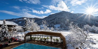 Hotels an der Piste - Wellnessbereich - Kanzelhöhe - Beheizter & Überdachbarer Außenpool (Winter 31°C)   - Genusshotel Almrausch