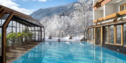 Hotels an der Piste - Wellnessbereich - Kanzelhöhe - Beheizter & Überdachbarer Außenpool (Winter 31°C)  - Genusshotel Almrausch