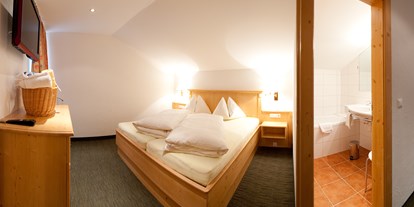 Hotels an der Piste - Wellnessbereich - Kanzelhöhe - Schlafzimmer Suite "Nockberge - Hotel Berghof