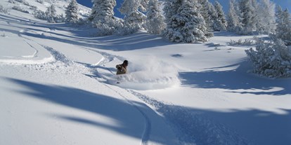 Hotels an der Piste - Skiservice: Skireparatur - Wagrain - frisch verschneit - die Fageralm - Familienhotel Unterreith