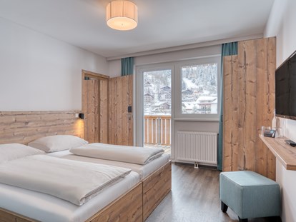 Hotels an der Piste - Hotel-Schwerpunkt: Skifahren & Familie - Familienzimmer - COOEE alpin Hotel Bad Kleinkirchheim