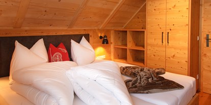 Hotels an der Piste - Ski-In Ski-Out - Kanzelhöhe - Schlafzimmer - Trattlers Hof-Chalets