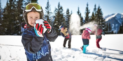 Hotels an der Piste - Kinderbetreuung - Leogang - Kinder im Schnee -  Hotel Alpine Palace