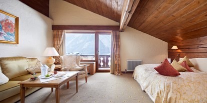 Hotels an der Piste - Suite mit offenem Kamin - Gartner Wand - Junior Suite  - Hotel Singer - Relais & Châteaux