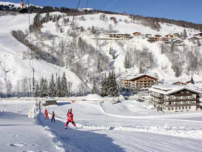 Hotels an der Piste - Ski-In Ski-Out - Österreich - Skischulübungsgelände vis à vis vom Hotel - Erstklassig & down to Earth - das bio-zertifizierte Gartenhotel Theresia****S 
