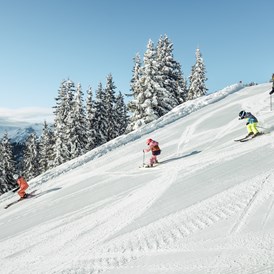 Skihotel: Skifahren mit der Familie auf der Schmittenhöhe in Zell am See - Hotel Sonnblick