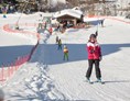 Skihotel: Ausgestattet mit neuester Technologie bringt unser Schlepp- und Tellerlift alle Skifahrer - groß und klein - sicher auf den Lärchenhof-Kogel - Der Lärchenhof