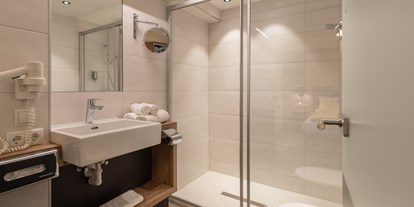 Hotels an der Piste - Skiverleih - Badezimmer Junior Suite Typ C - stefan Hotel