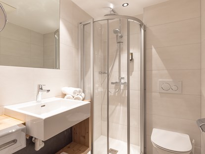 Hotels an der Piste - Wellnessbereich - Badezimmer Komfort - stefan Hotel