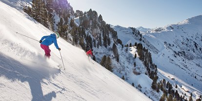 Hotels an der Piste - Après Ski im Skigebiet: Schirmbar - Finkenberg - Österreichs steilstes Pistenerlebnis mit 78 % Gefälle - die Harakiri am Penken - Mayrhofner Bergbahnen