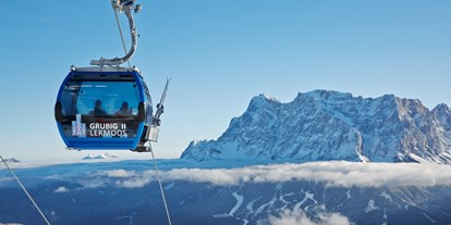 Hotels an der Piste - Après Ski im Skigebiet: Schirmbar - Tirol - 10er- Kabinenbahn Grubig II - Skigebiet Grubigstein/Lermoos - Zugspitz Arena