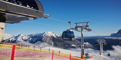 Hotels an der Piste - Après Ski im Skigebiet: Schirmbar - Bergstation Kabinenbahn Grubig II - Skigebiet Grubigstein/Lermoos - Zugspitz Arena