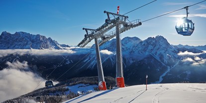 Hotels an der Piste - Après Ski im Skigebiet: Schirmbar - Tirol - Kabinenbahn Grubig II - Skigebiet Grubigstein/Lermoos - Zugspitz Arena