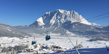 Hotels an der Piste - Après Ski im Skigebiet: Schirmbar - Tirol - 8er-Kabinenbahn Familyjet - Skigebiet Grubigstein/Lermoos - Zugspitz Arena