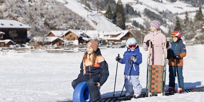 Hotels an der Piste - Rodeln - Skigebiet Dorfgastein-Großarltal - Feriendorf Holzleb'n