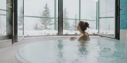 Hotels an der Piste - Verpflegung: Halbpension - Urreiting - Nach dem Skifahren rein in den Whirlpool - Hotel Berghof | St. Johann in Salzburg