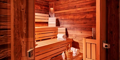 Hotels an der Piste - Hotel-Schwerpunkt: Skifahren & Familie - Enkerbichl - private Sauna in jeder Hütte - Almdorf Flachau