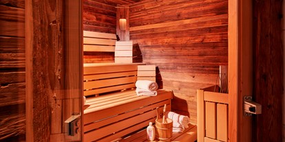 Hotels an der Piste - Preisniveau: moderat - Höch (Flachau) - private Sauna in jeder Hütte - Almdorf Flachau
