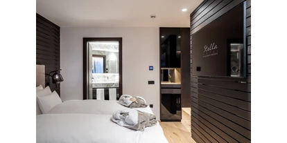 Hotels an der Piste - Skiraum: Skispinde - Wolkenstein in Gröden - Room Superior - Hotel Stella - My Dolomites Experience