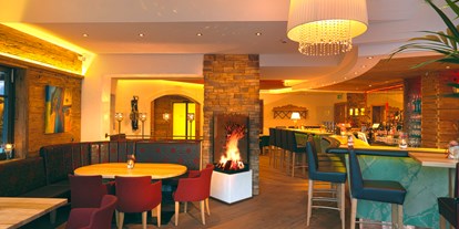 Hotels an der Piste - Suite mit offenem Kamin - Heißingfelding - Kaminbar - Aktivhotel Alpendorf