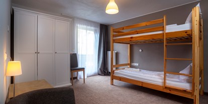 Hotels an der Piste - Sauna - Tirol - Seperates Kinderzimmer Familienzimmer Alpenhof - SCOL Sporthotel Großglockner