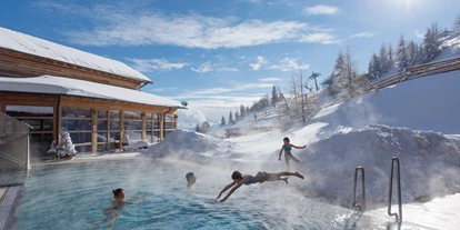 Hotels an der Piste - Skiraum: videoüberwacht - Mittewald (Villach) - Von der Piste direkt in die Pools - Mountain Resort Feuerberg
