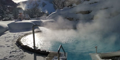 Hotels an der Piste - Pools: Außenpool beheizt - Uttendorf (Uttendorf) - Outdoorpool im Schnee 30°C - The RESI Apartments "mit Mehrwert"