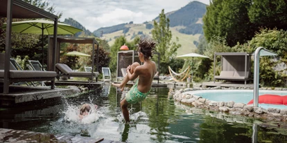 Hotels an der Piste - Skiraum: versperrbar - Kirchberg in Tirol - The Resi Apartments 
Pools und Schwimmteich im Garten - The RESI Apartments "mit Mehrwert"