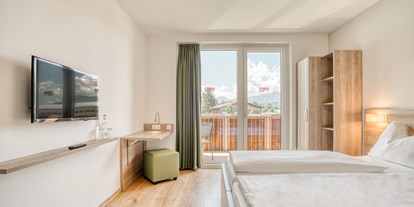 Hotels an der Piste - Skiraum: versperrbar - PLZ 5730 (Österreich) - Standard Zimmer - COOEE alpin Hotel Kitzbüheler Alpen