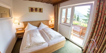 Hotels an der Piste - Verpflegung: Frühstück - Labientschach - Junior Suite "Enzian Stube" Schlafzimmer - Hotel Berghof