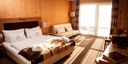 Hotels an der Piste - Skiraum: Skispinde - Zimmer mit auszihebarer Couch und Balkon
(Foto: Georg Brezlanovits) - Familienhotel Berger ***superior