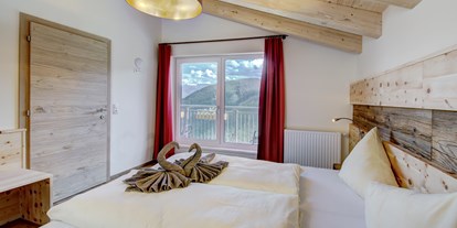 Hotels an der Piste - Skikurs direkt beim Hotel: für Kinder - Appartement Zirbe Seeblick Schlafzimmer - Berghotel Jaga-Alm