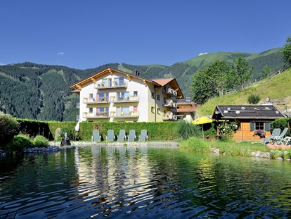 Hotels an der Piste - Wellnessbereich - Skigebiet Schmittenhöhe - Das Berghotel Jaga-Alm im Sommer - Berghotel Jaga-Alm