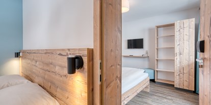 Hotels an der Piste - Verpflegung: Halbpension - Nockberge - Familienzimmer - COOEE alpin Hotel Bad Kleinkirchheim