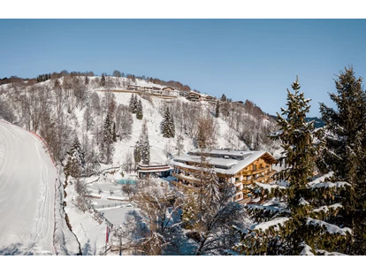 Hotels an der Piste - Hotel-Schwerpunkt: Skifahren & Familie - Going am Wilden Kaiser - Gartenhotel Theresia in Saalbach-Hinterglemm
"Vom Frühstück auf die Piste, von der Piste in die Pools" - Erstklassig & down to Earth - das bio-zertifizierte Gartenhotel Theresia****S 