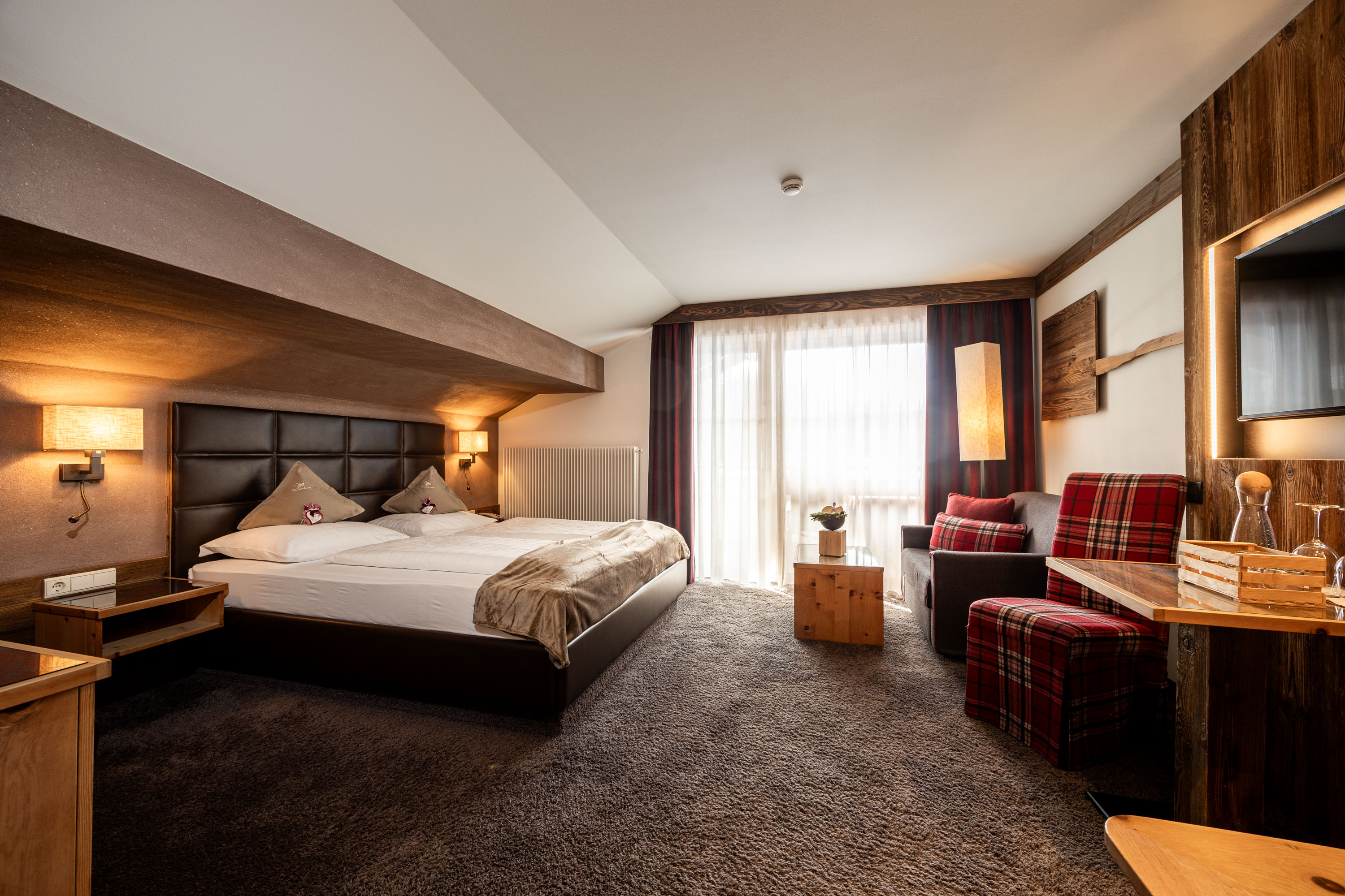 Wohlfühlhotel Falzeben Zimmerkategorien Kaminzimmersuite mit Luis Trenker- Infrarotkabine